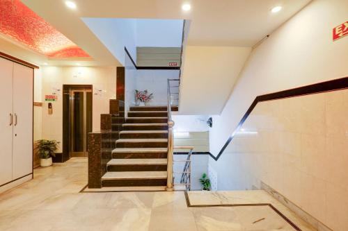 a staircase in a building with a stair case at Hindustan By Backpackers Heaven - Traveller's Choice Award 2025 Best of Best Winning Hotel in New Delhi