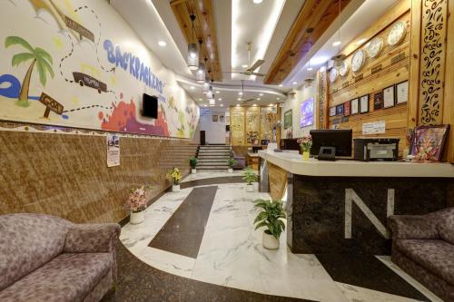 a lobby with two couches and a waiting room at Hindustan By Backpackers Heaven - Traveller's Choice Award 2025 Best of Best Winning Hotel in New Delhi