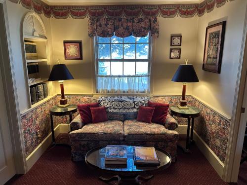a living room with a couch and a window at Asa Ransom House in Clarence