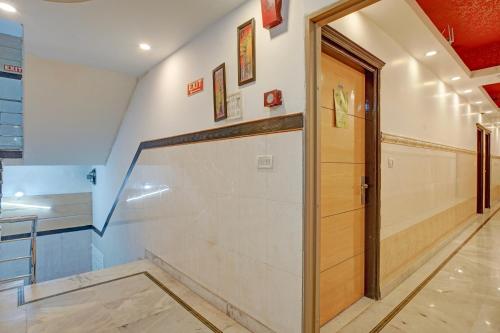 a hallway with a basketball court with a wooden door at Hindustan By Backpackers Heaven - Traveller's Choice Award 2025 Best of Best Winning Hotel in New Delhi
