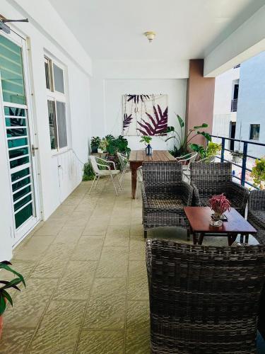 a living room with couches and a table at Kenting Chingshan Inn in Kenting