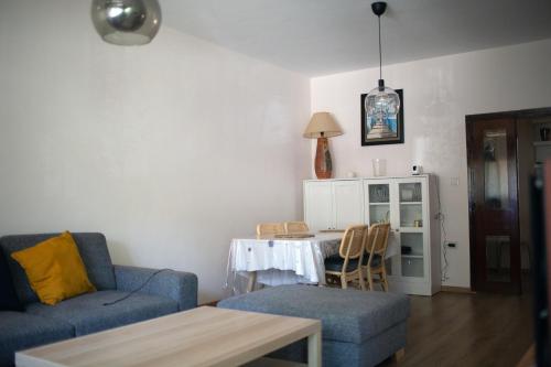 a living room with a couch and a table at Imperial Rabat - MAKE IT YOURS in Rabat