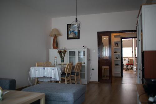 a living room with a table and a dining room at Imperial Rabat - MAKE IT YOURS in Rabat