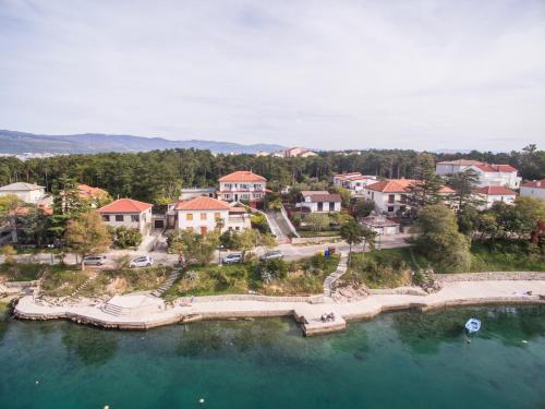 an aerial view of a resort on a lake at Seafront apartment with balcony-50 m from the sea in Šilo