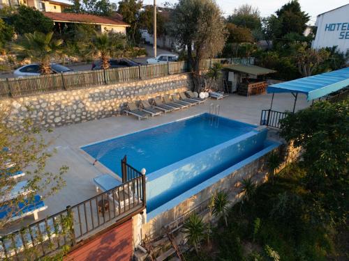an overhead view of a swimming pool in a yard at Hotel Sema in Patara