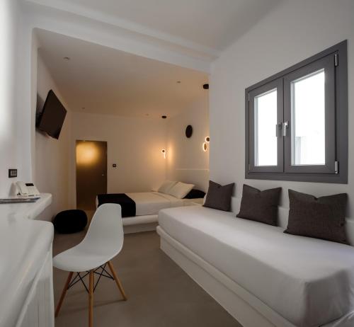 Postel nebo postele na pokoji v ubytování Tataki Family Hotel