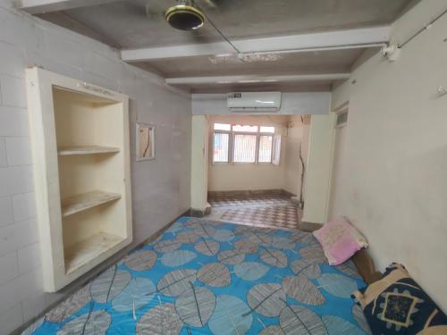 a bedroom with a bed in a room at ShreeJi Dham in Mathura