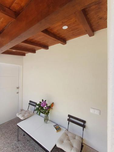 a dining room with a table and two chairs at Boa Ventura Home in Porto