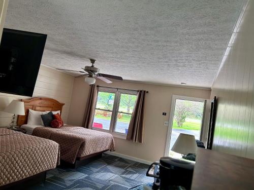 Ένα ή περισσότερα κρεβάτια σε δωμάτιο στο Stony Creek Motel