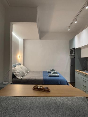 a bedroom with a bed with shoes on it at Elegant City Retreat Walk to Landmarks & Metro in Athens