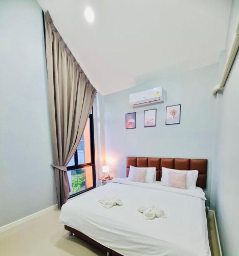 Postel nebo postele na pokoji v ubytování เคียงรักพูลวิลล่าเชียงคาน-Khiang Rak Pool Villa Chiangkhan