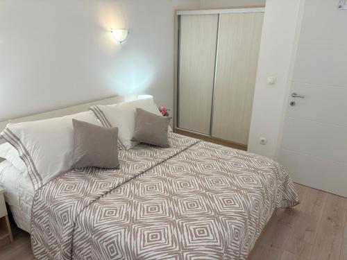 a bedroom with a bed with two pillows on it at Apartment Anđelina, Split in Split