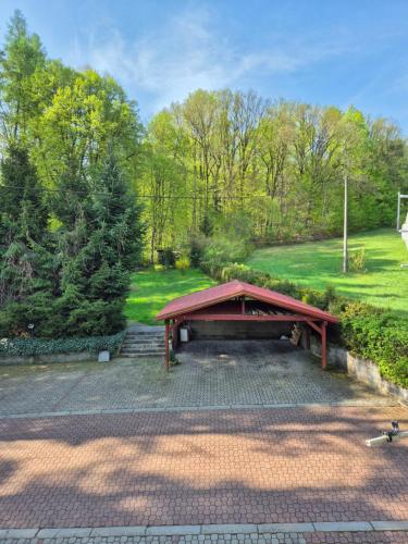 a picnic table in the middle of a park at Les 6 in Zlín