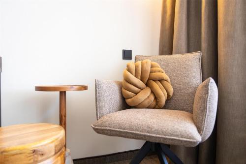 a rope sitting on a chair in a room at Flonk Hotel Groningen Centre, BW Signature Collection in Groningen