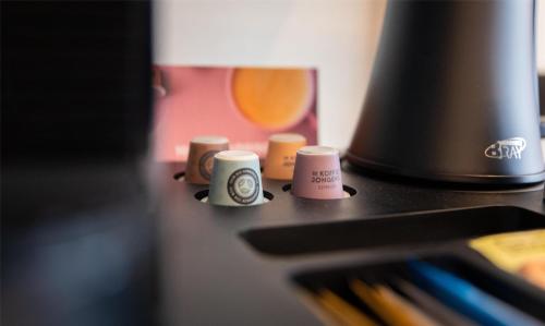 a group of three coffee cups sitting on a table at Flonk Hotel Groningen Centre, BW Signature Collection in Groningen