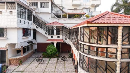 an overhead view of a building with bikes parked in the courtyard at SHELDON RESORT & SPA in Phalta