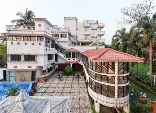 an aerial view of a house with a building at SHELDON RESORT & SPA in Phalta