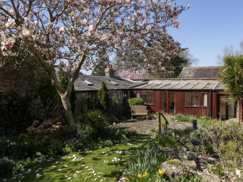 a house with a garden in front of it at The Cottage at Rocklands Farm in Ross on Wye