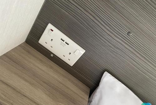 a electrical outlet on the side of a bed at 15 Willow Wynd Thurston Manor in Dunbar