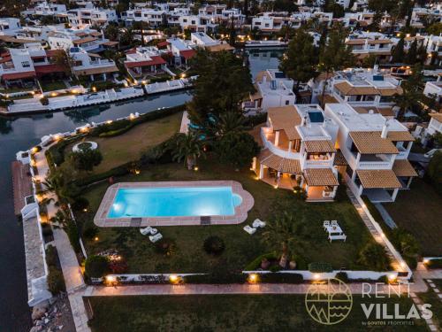 an aerial view of a resort with a swimming pool at Beachfront Villa Armonia in Porto Hydra by goutos properties in Ermioni