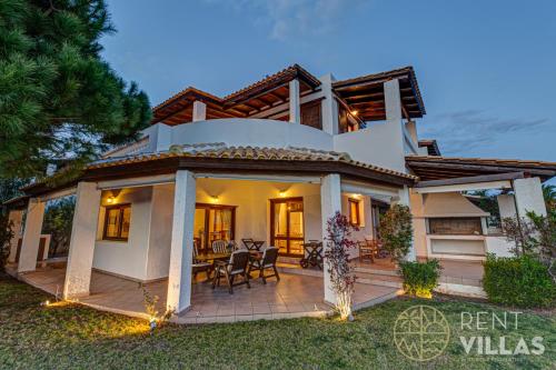 a villa with a view of the back yard at Beachfront Villa Armonia in Porto Hydra by goutos properties in Ermioni