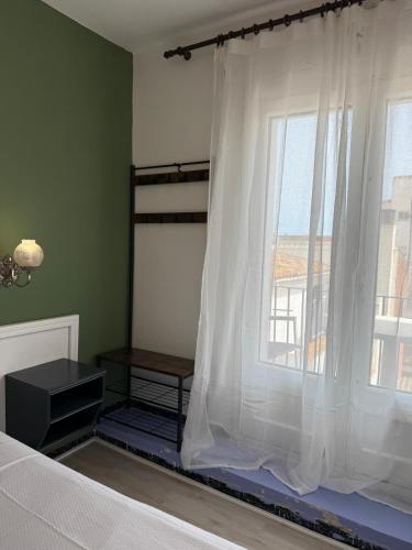 Ένα ή περισσότερα κρεβάτια σε δωμάτιο στο Nou Roser