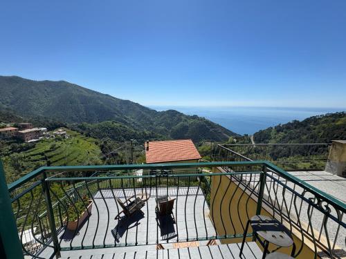 a balcony with chairs and a view of the ocean at Affittacamere PZ in Vernazza