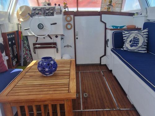 a small table in the back of a boat at Salvador BAHIA Boat and Breakfast in Lido di Ostia