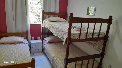 Postel nebo postele na pokoji v ubytování Hospedaria Casa de Maria