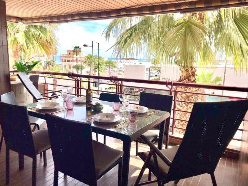 a table on a balcony with a view of the ocean at Mar y Vistas Puerto Santa Pola in Santa Pola