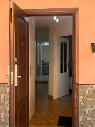 an open door leading into a room with a hallway at VEL-Шевченка in Chernivtsi
