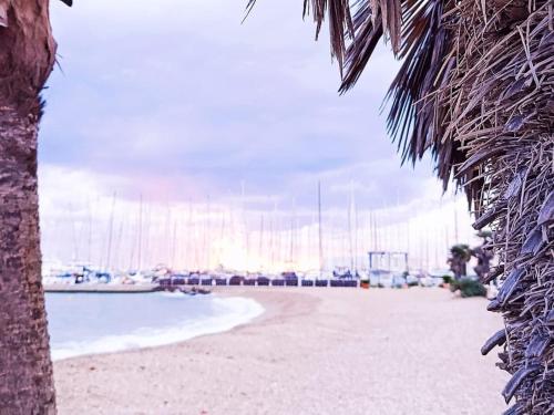 a view of a beach with boats in the water at Salvador BAHIA Boat and Breakfast in Lido di Ostia