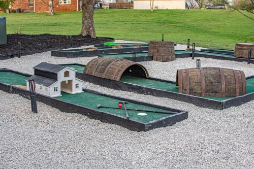 a model of a golf course with houses and a bridge at Heated Pool, Hot Tub, Mini Golf, Theater-Sleeps 28 in Frankfort