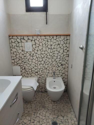 a bathroom with a toilet and a sink at Hotel Garisenda B&B - in Centro a Riccione - in Riccione
