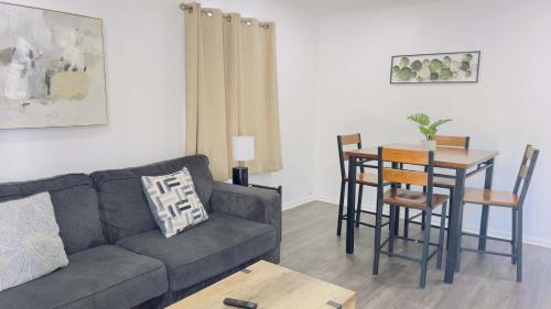 a living room with a couch and a table at Close to the beach #4 Cozy condo in Myrtle Beach