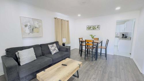 a living room with a couch and a table at Close to the beach #4 Cozy condo in Myrtle Beach