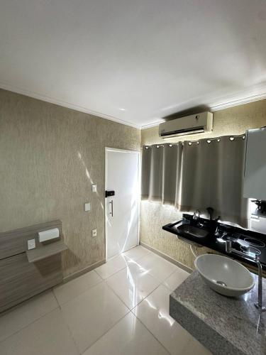 a bathroom with a sink and a shower at RiverSide 101 in Petrolina