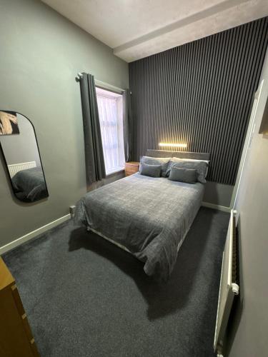Postel nebo postele na pokoji v ubytování Clifton Private Hotel