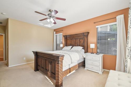 a bedroom with a bed and a ceiling fan at Gilbert Getaway in Gilbert
