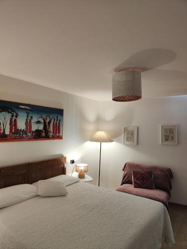 a bedroom with a bed and a lamp in it at B&B Ai Castagni in Tenno