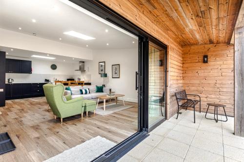 a living room with a couch and a table at Cart Shed 1 in Oxford