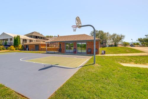 a basketball court in front of a house with a basketball hoop at Sun-Filled Condo with Smith Mountain Lake Views in Moneta