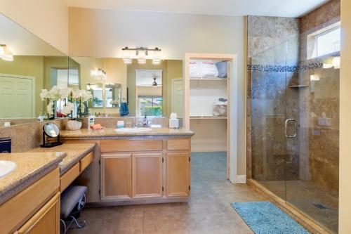 a large bathroom with a shower and a sink at Stunning 5 Star Oasis in Palm Springs