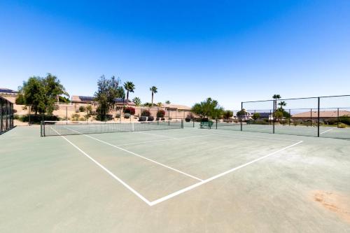 a tennis court with a net on it at Stunning 5 Star Oasis in Palm Springs