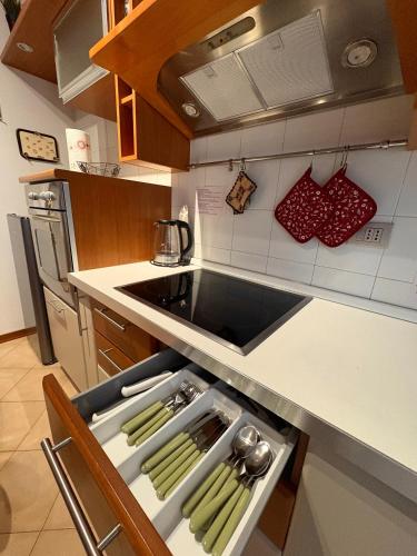 a kitchen with a stove top oven next to a counter at Dalla Bibi in Quarto Inferiore