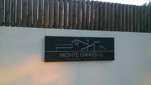 a sign for a house on the side of a wall at Monte Girassol - The Lisbon Country House in Quinta das Faias
