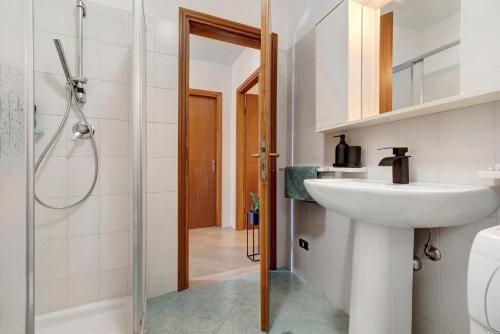 a bathroom with a sink and a shower at Casa Vacanze Leon Tremosine in Tremosine Sul Garda