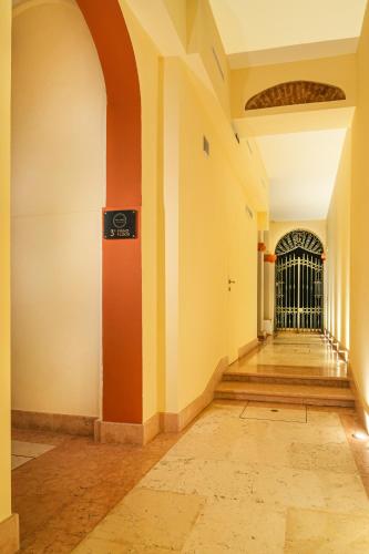 an empty hallway with a gate in a building at My Loft in Ferrara