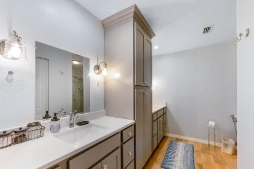 a bathroom with a sink and a mirror at 3BR Wesley Chapel Retreat with Private Pool - Pet-Friendly - Spacious Parking in Zephyrhills