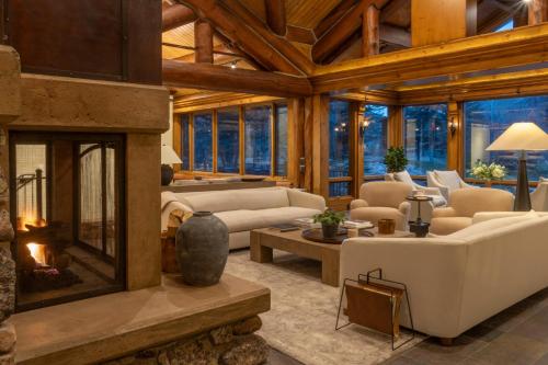 a living room filled with furniture and a fireplace at Apres Lodge 5 Bedroom in Hailey